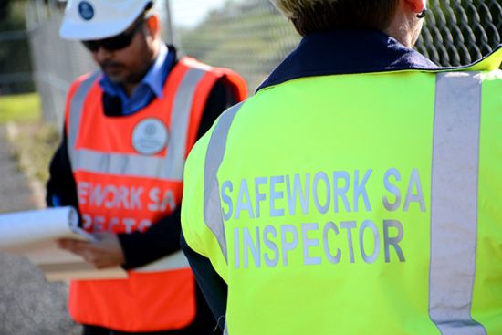 Two SafeWork SA Inspectors in hi vis jackets